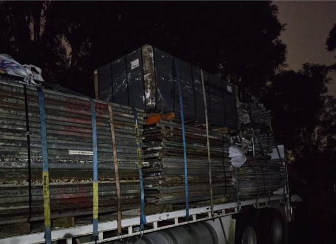 Formwork loaded on truck at dusk